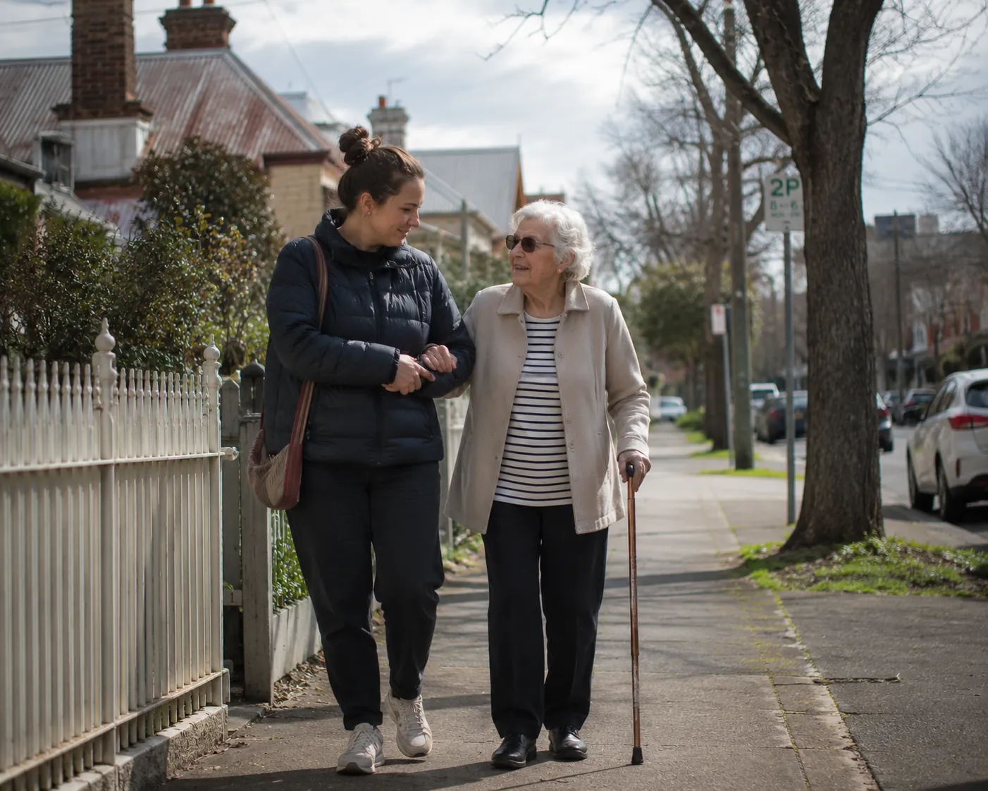 An NDIS participant in their local community with a support worker